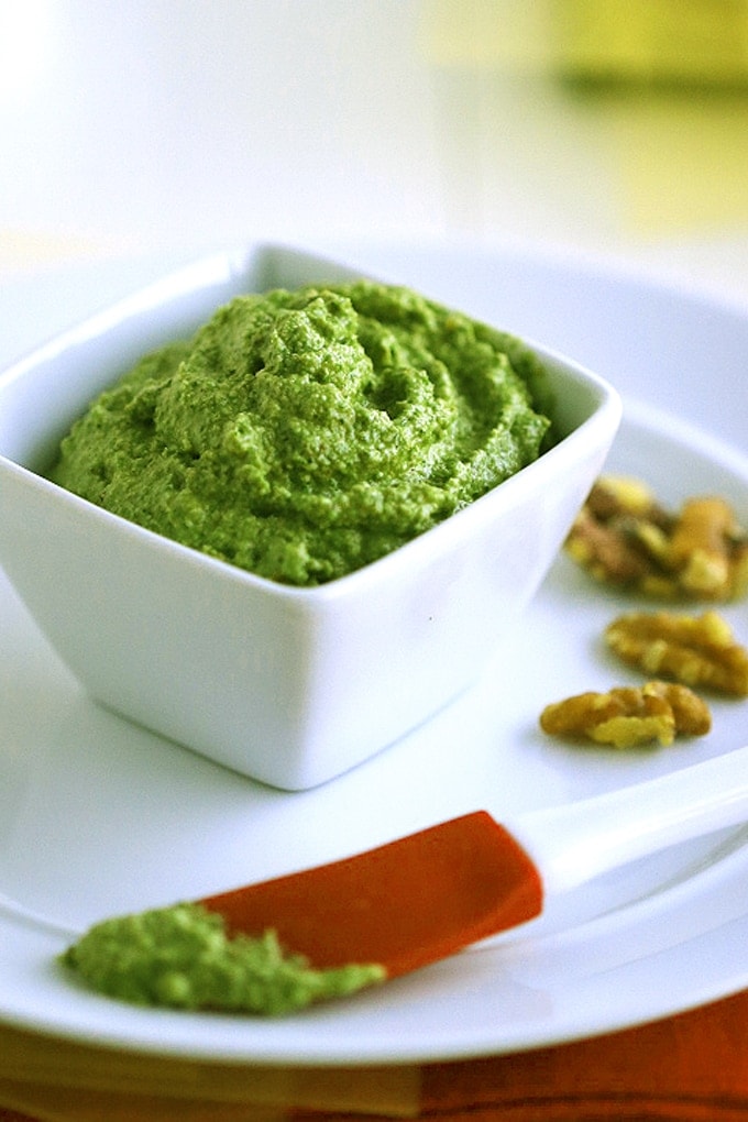 A bowl of pesto sauce on a plate