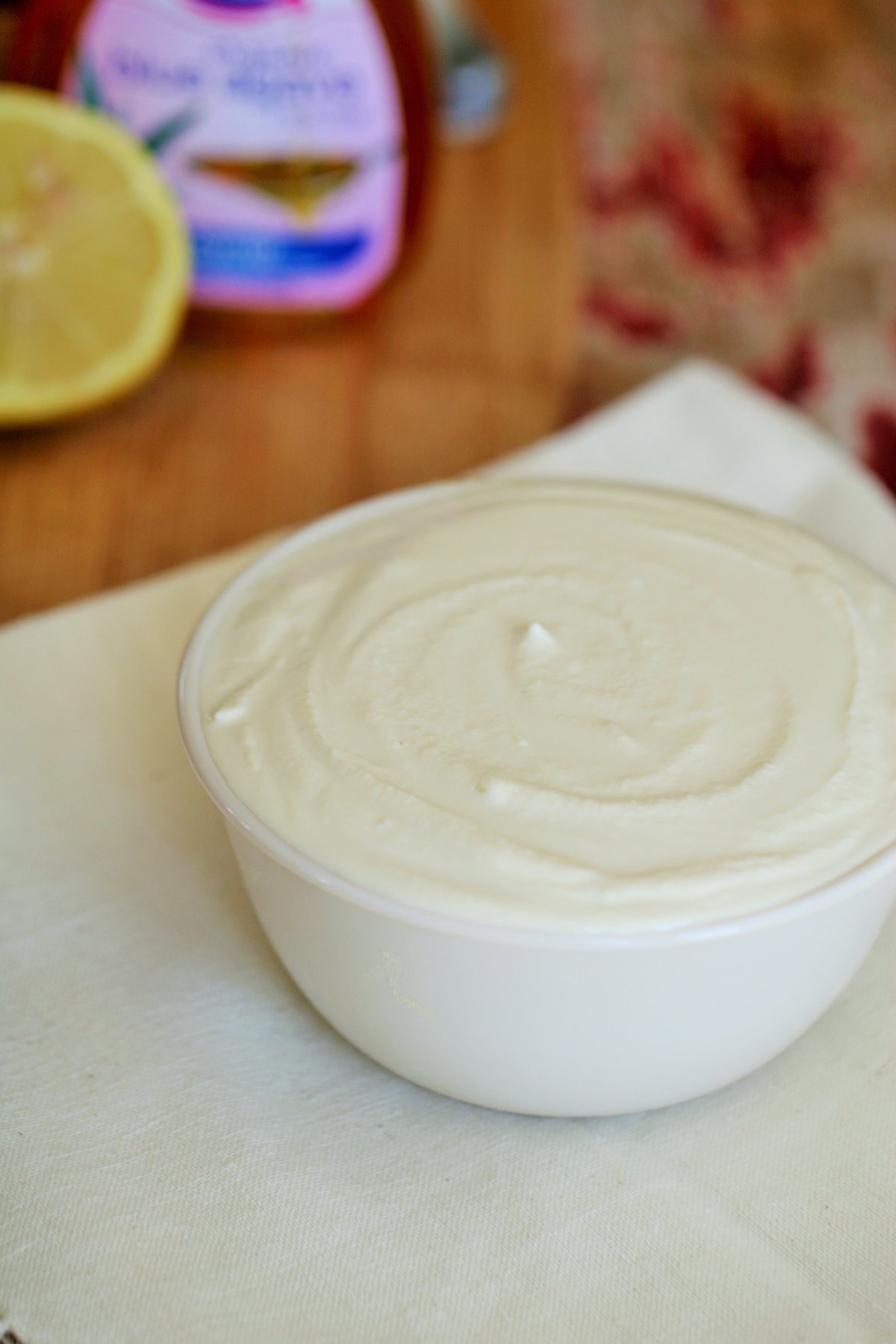 A cup of sour cream on a table