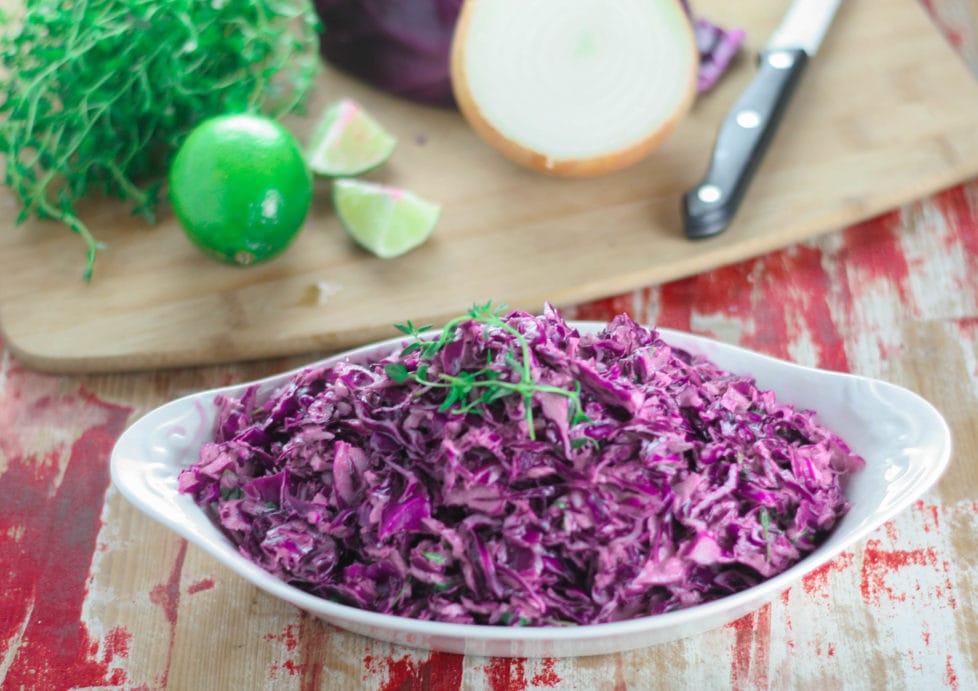 A bowl of purple slaw on a table