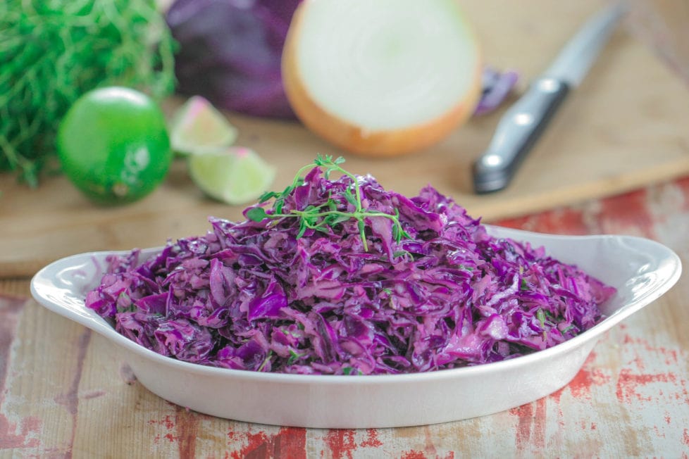 A bowl filled with purple cabbage slaw