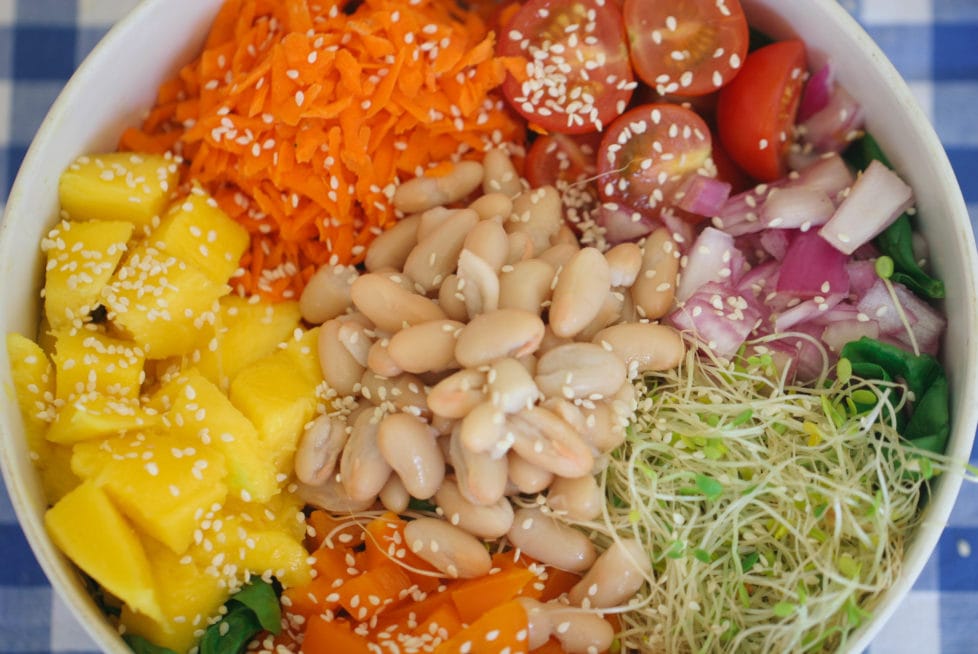 A close up of ingredients in bowl of salad