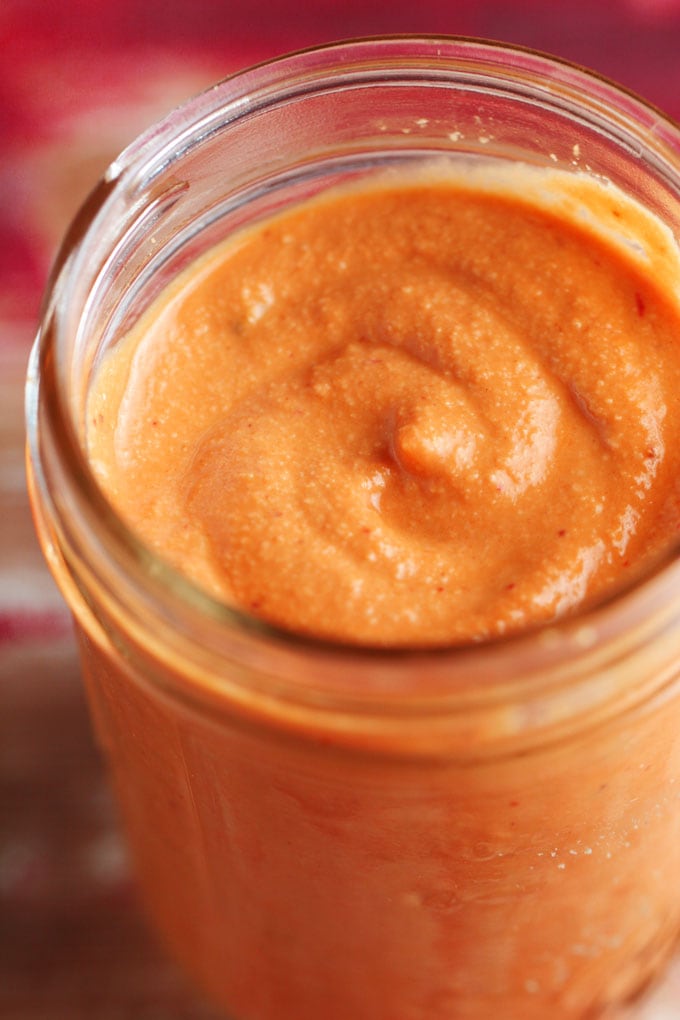 A close up of Chipotle sauce in a jar 
