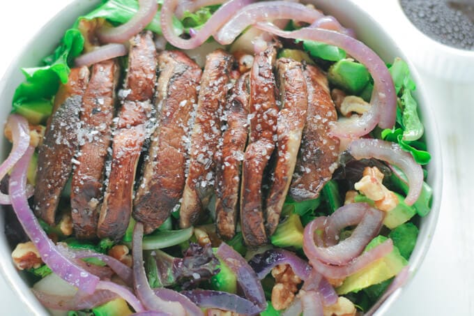 A closeup of salad with mushroom and Pecan