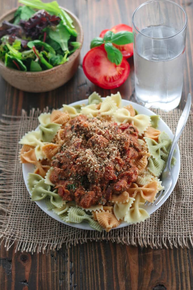 An overhead shot of a plate of pasta with pasta sauce