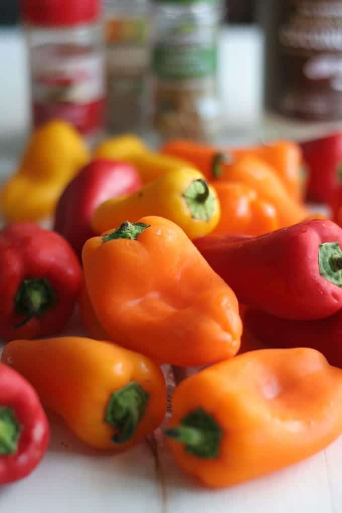 A plate of red, orange and yellow bell peppers