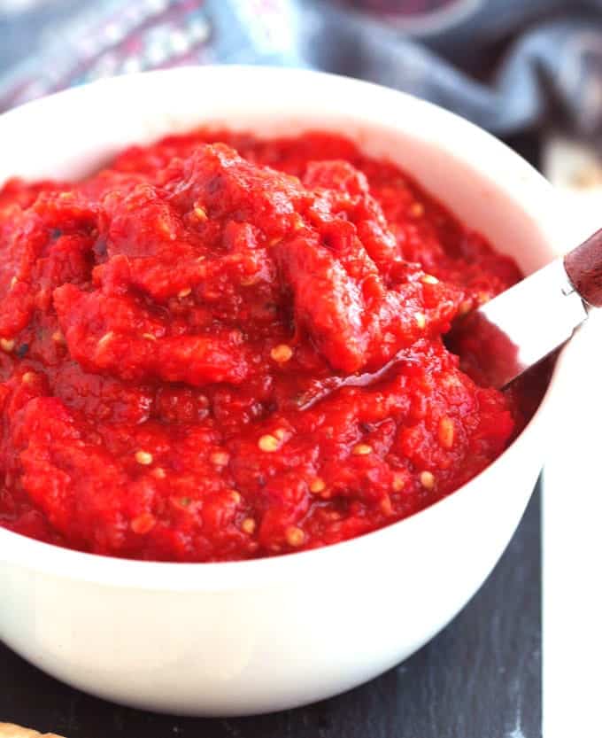 roasted red pepper and eggplant relish in a white bowl 