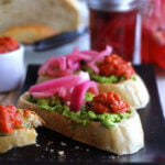 A close up of a avocado tartines on a platter