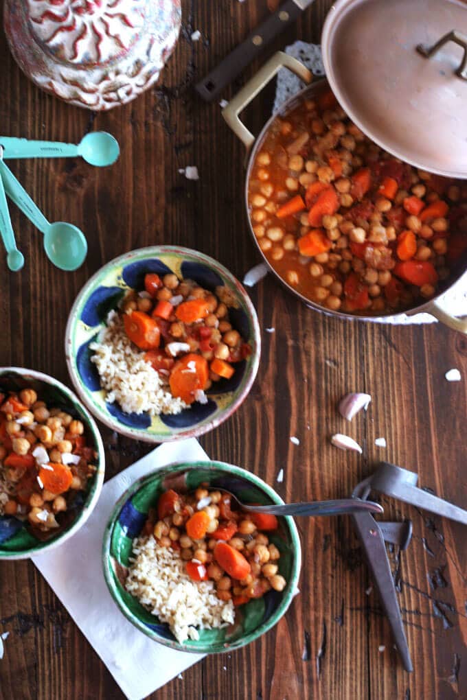 bowls of stew on a wooden table