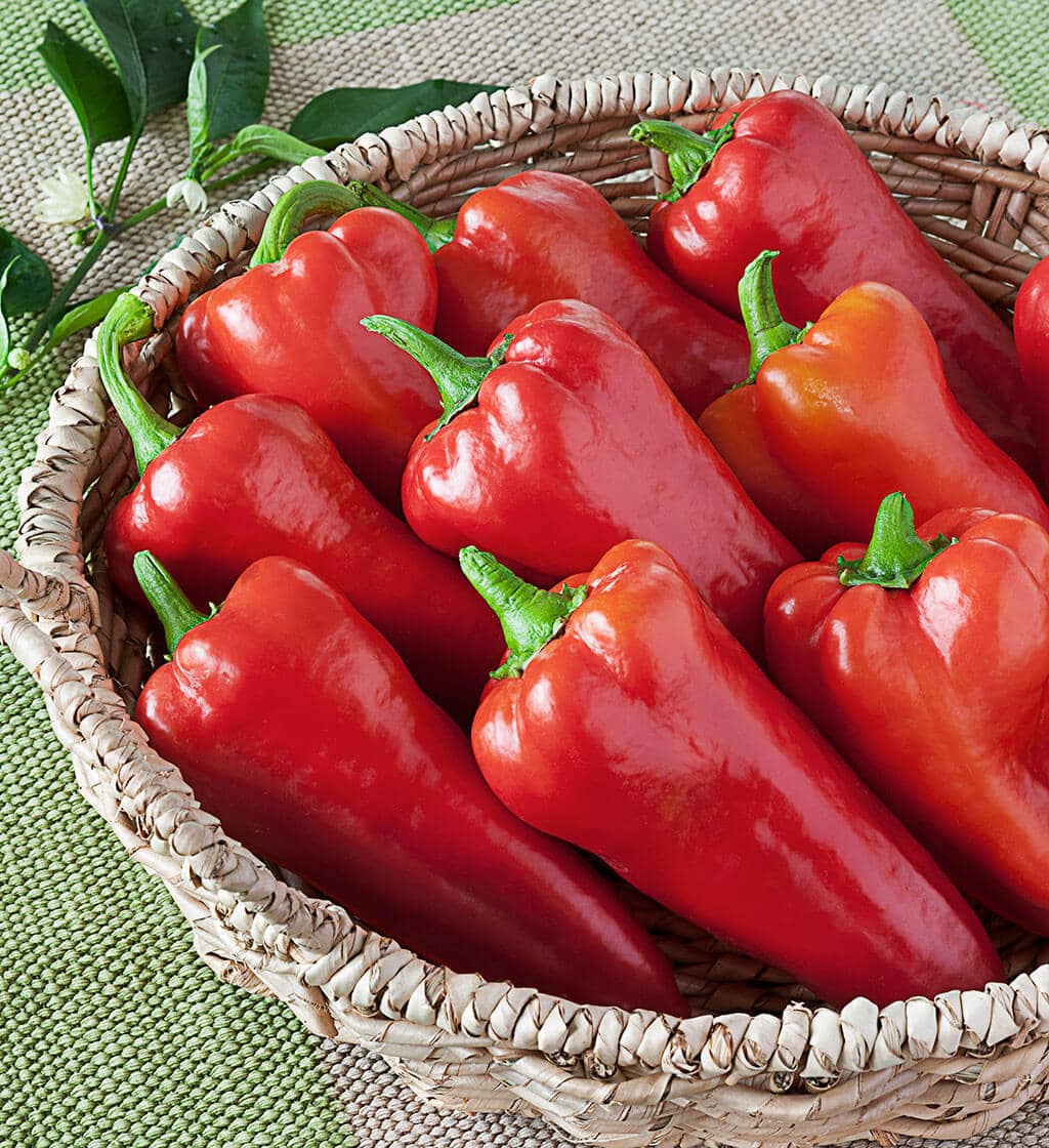 Red bell peppers in a wicker basket