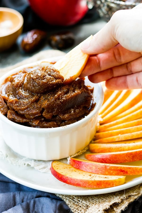 Pumpkin Caramel Dip with cracker dipping into it