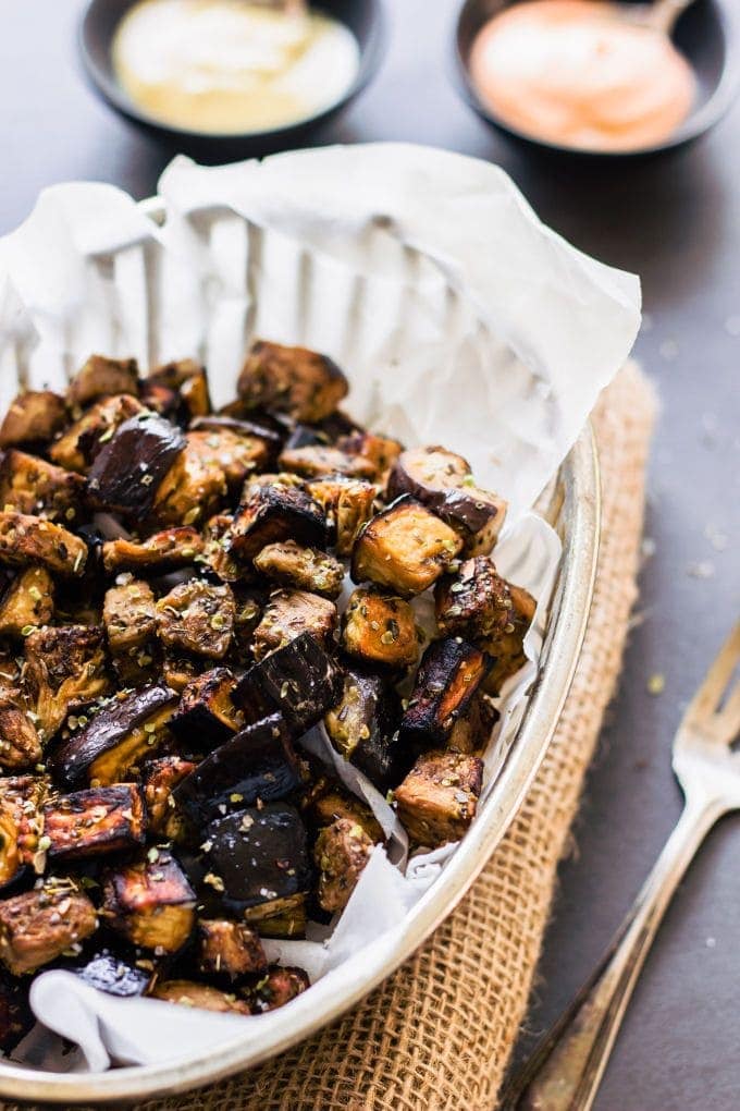 Roasted Eggplant in a clear dish on a gray table