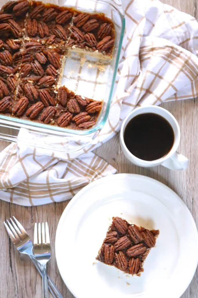 Vegan Pecan Pie Bars in a casserole dish with one missing