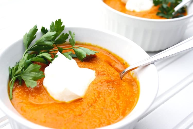 Carrot, Turmeric and Ginger Soup in w white bowl 