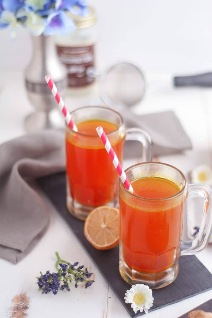 overhead picture of turmeric tonic in two glasses