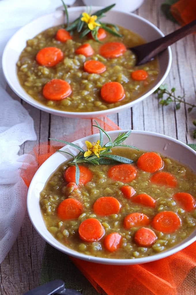 two bowls of soup on a wooden table