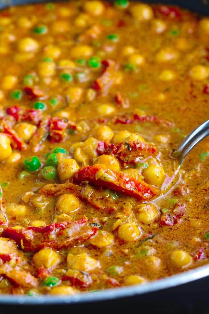 A close up of curry cooking in a pot