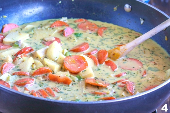 soup cooking on a stove in a pot