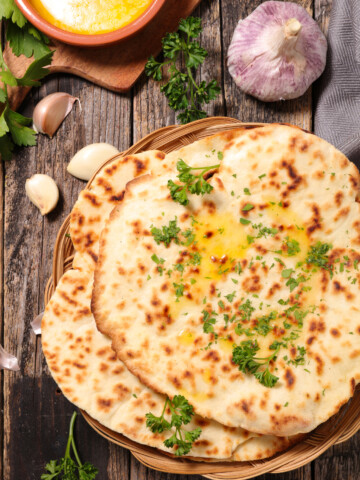 vegan naan with garlic on a wooden table