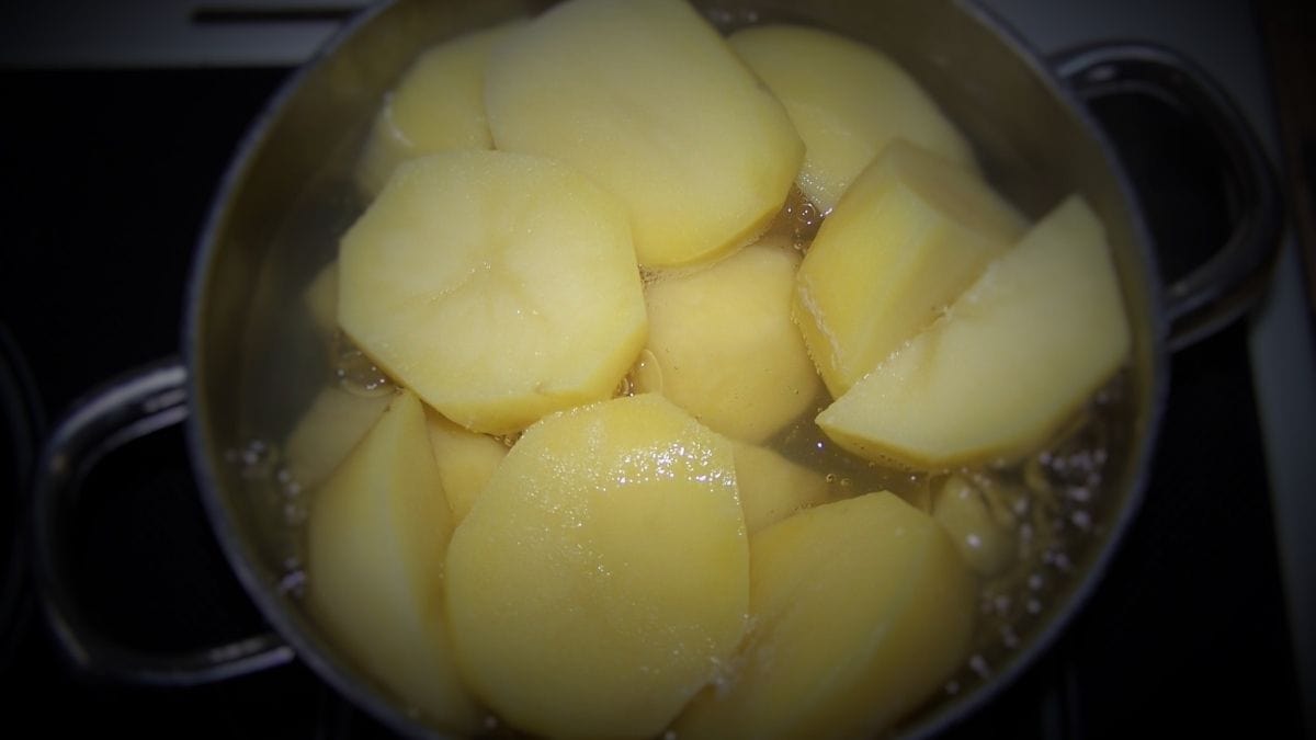 potatoes in a pot covered with water waiting to boil