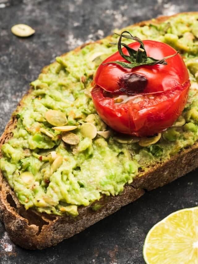 Rye bread toast with mashed avocado and tomato