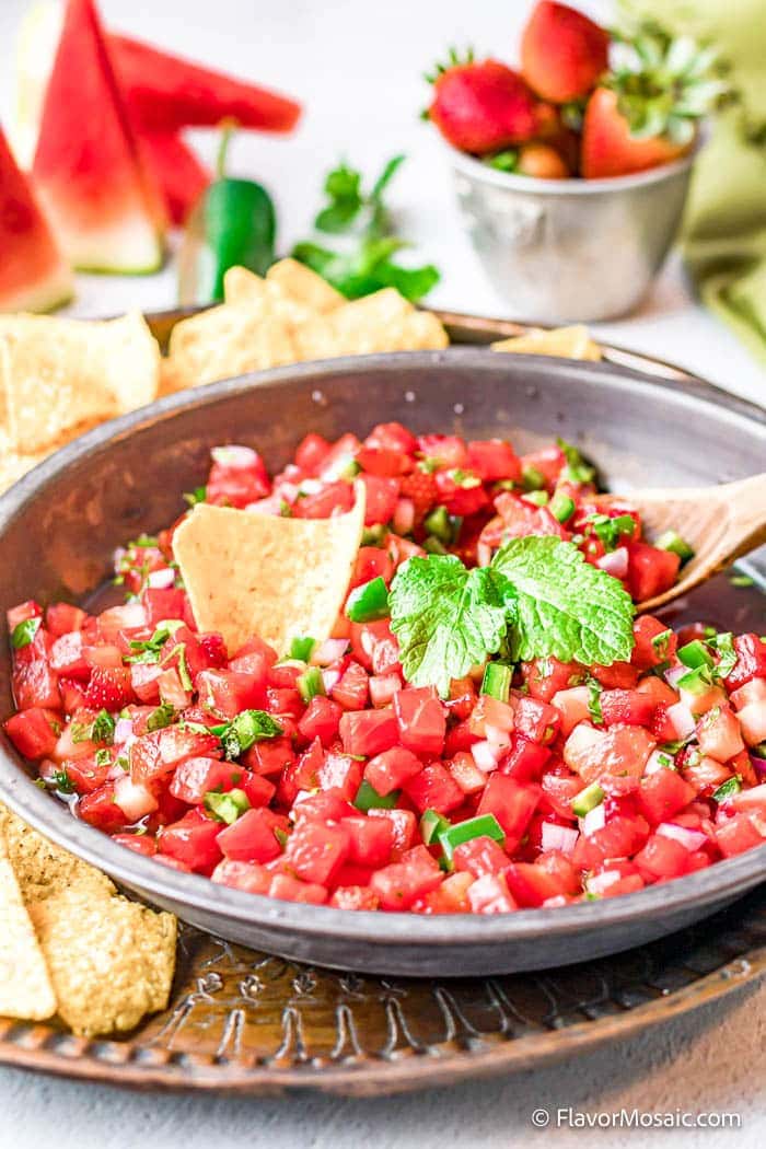 watermelon homemade salsa in a bowl on a cement table