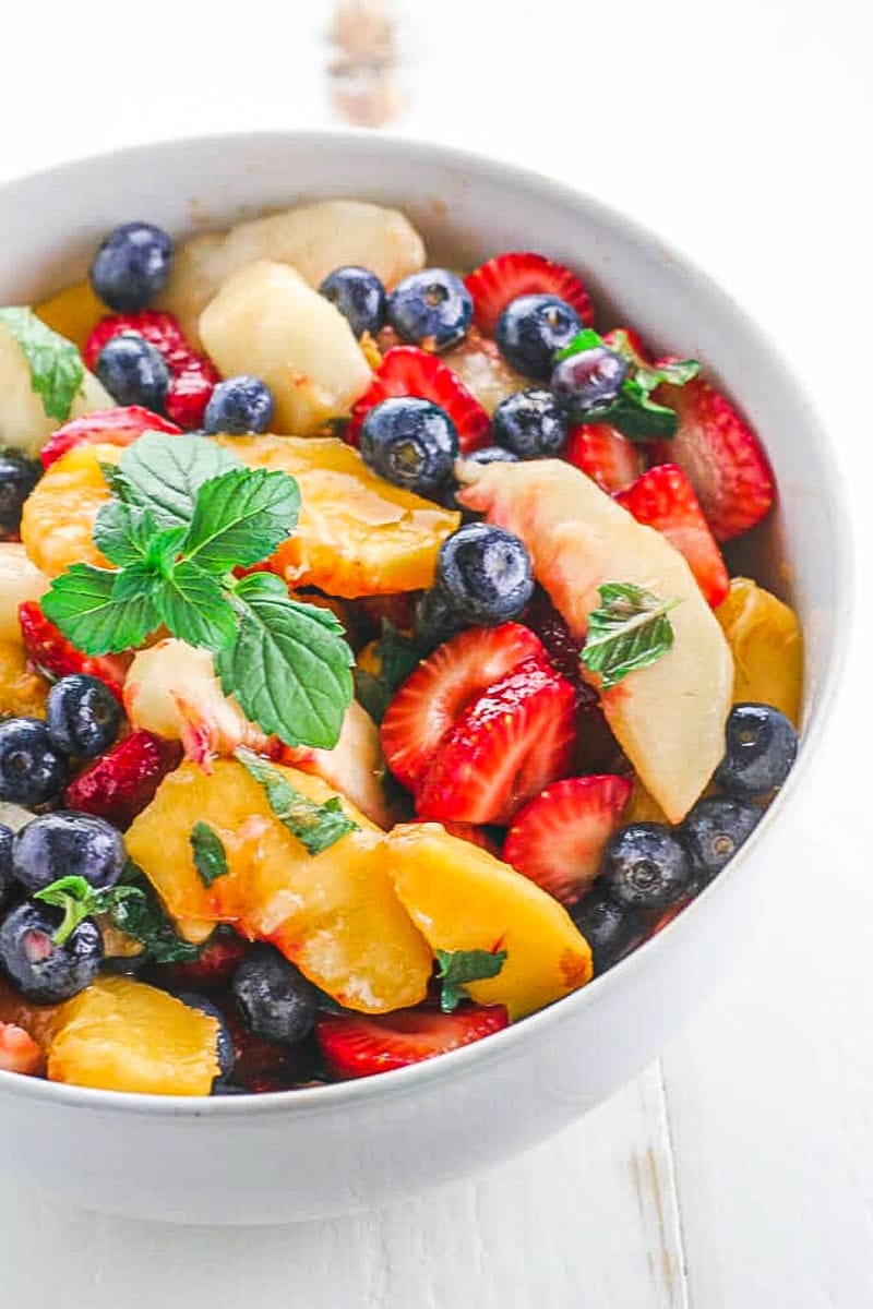 closeup of vegan fruit salad with mint