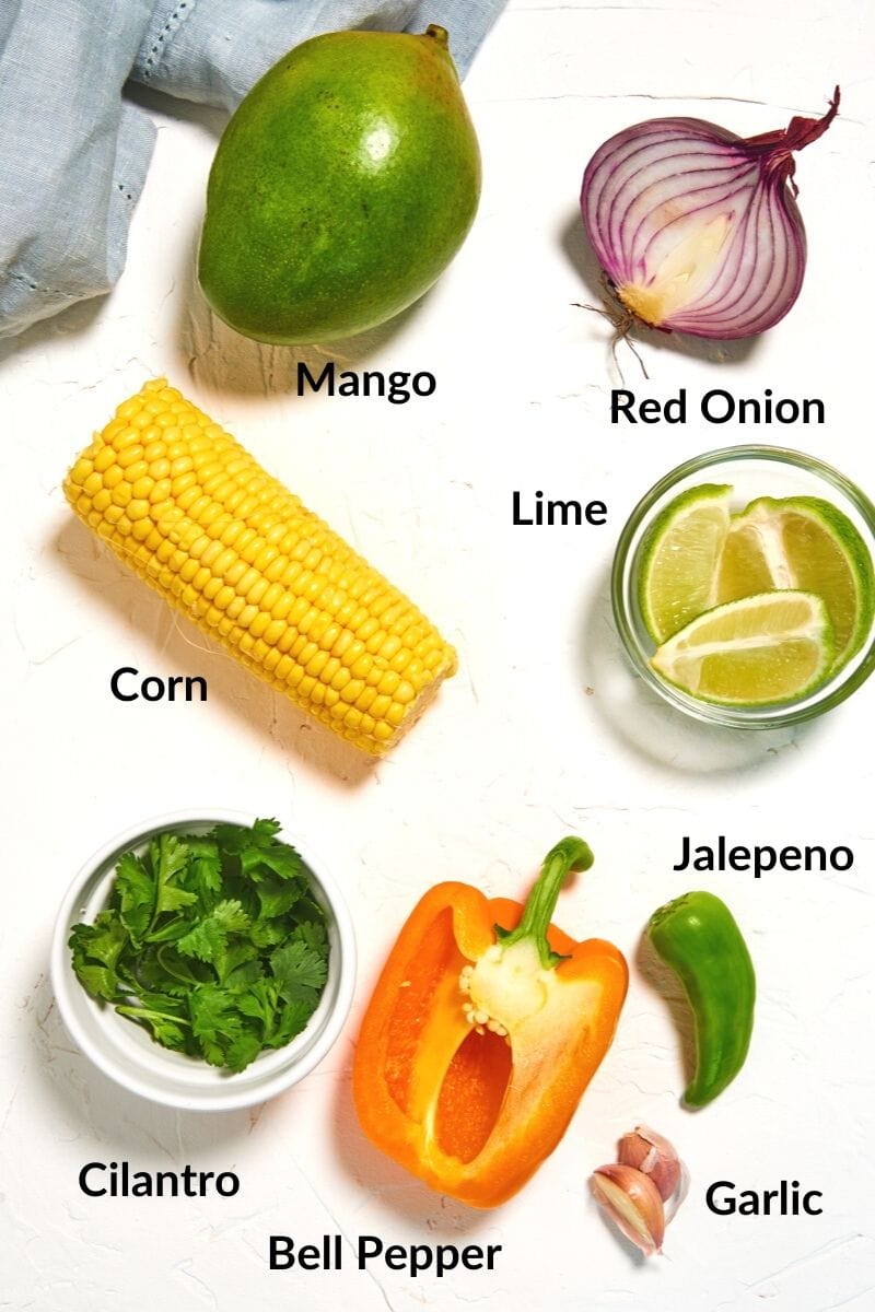 labeled salsa ingredients on a white table