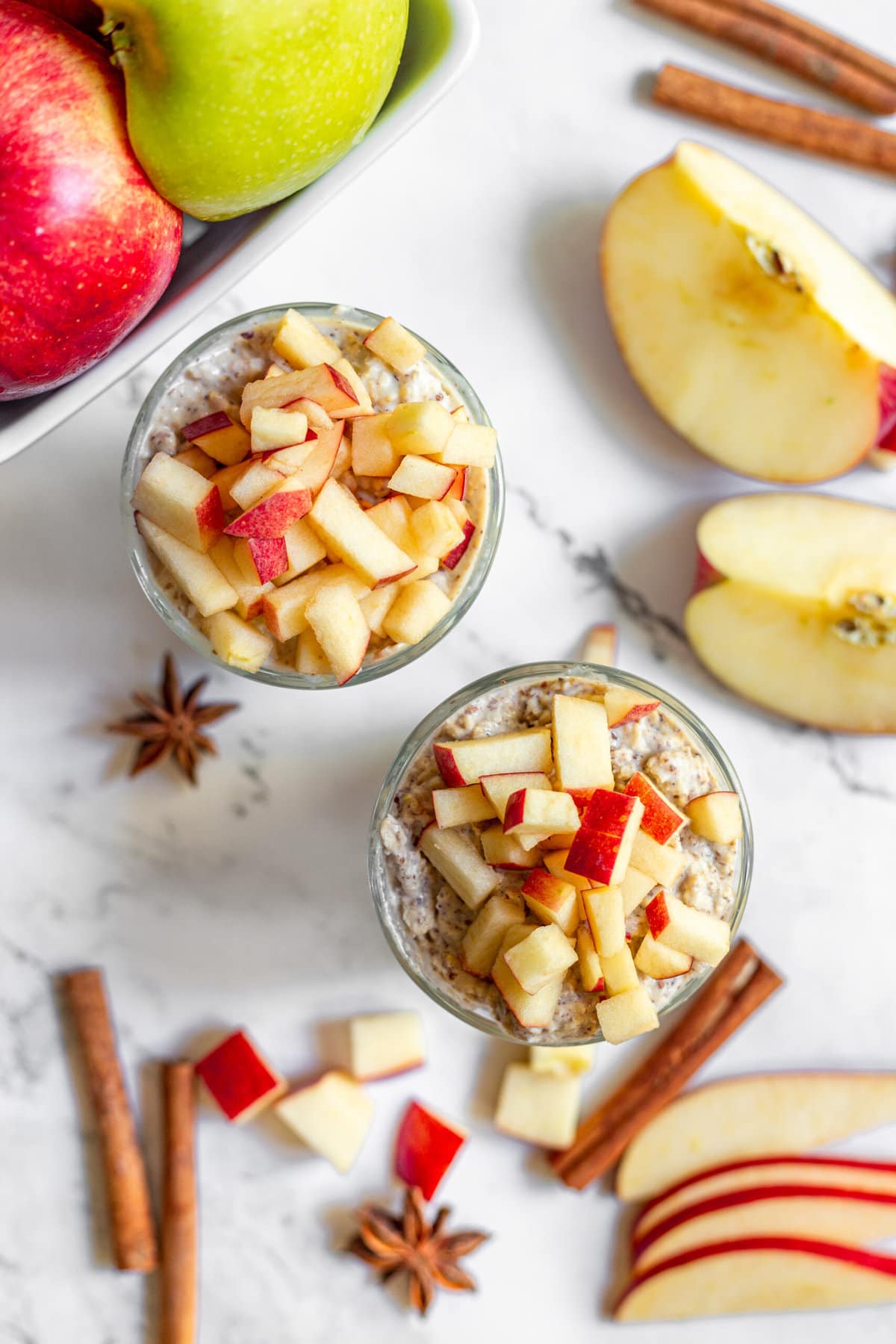 overhead view of apple pie overnight oats on white table