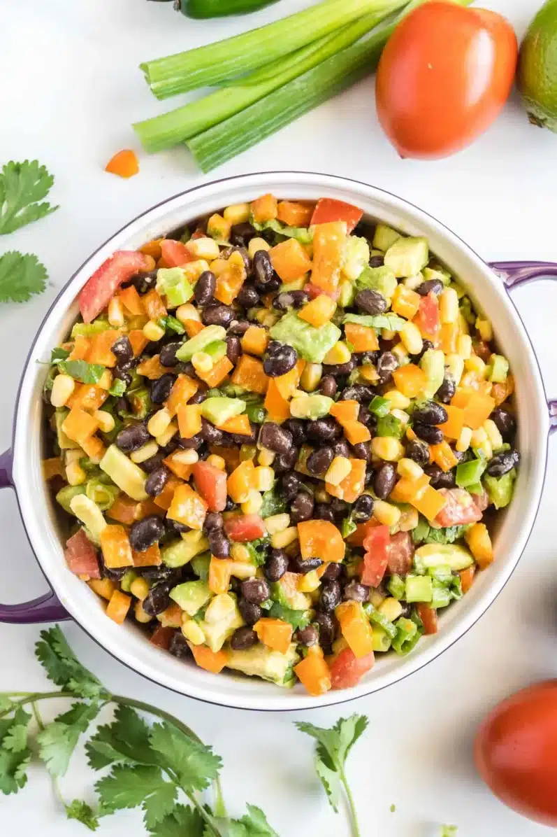 bowl of corn and black bean salsa on a white table