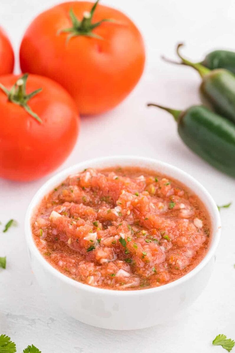 fresh garden salsa on a white table side view