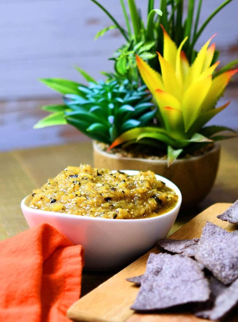 homemade salsa recipe roasted pineapple tomatillo in a white bowl on a wood table