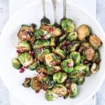 overhead view of air fryer Brussel sprouts on a white plate