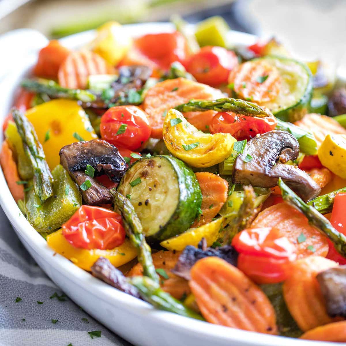 a white plate full of roasted vegetables