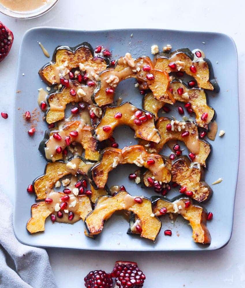 a sheet pan filled with roasted acorn squash