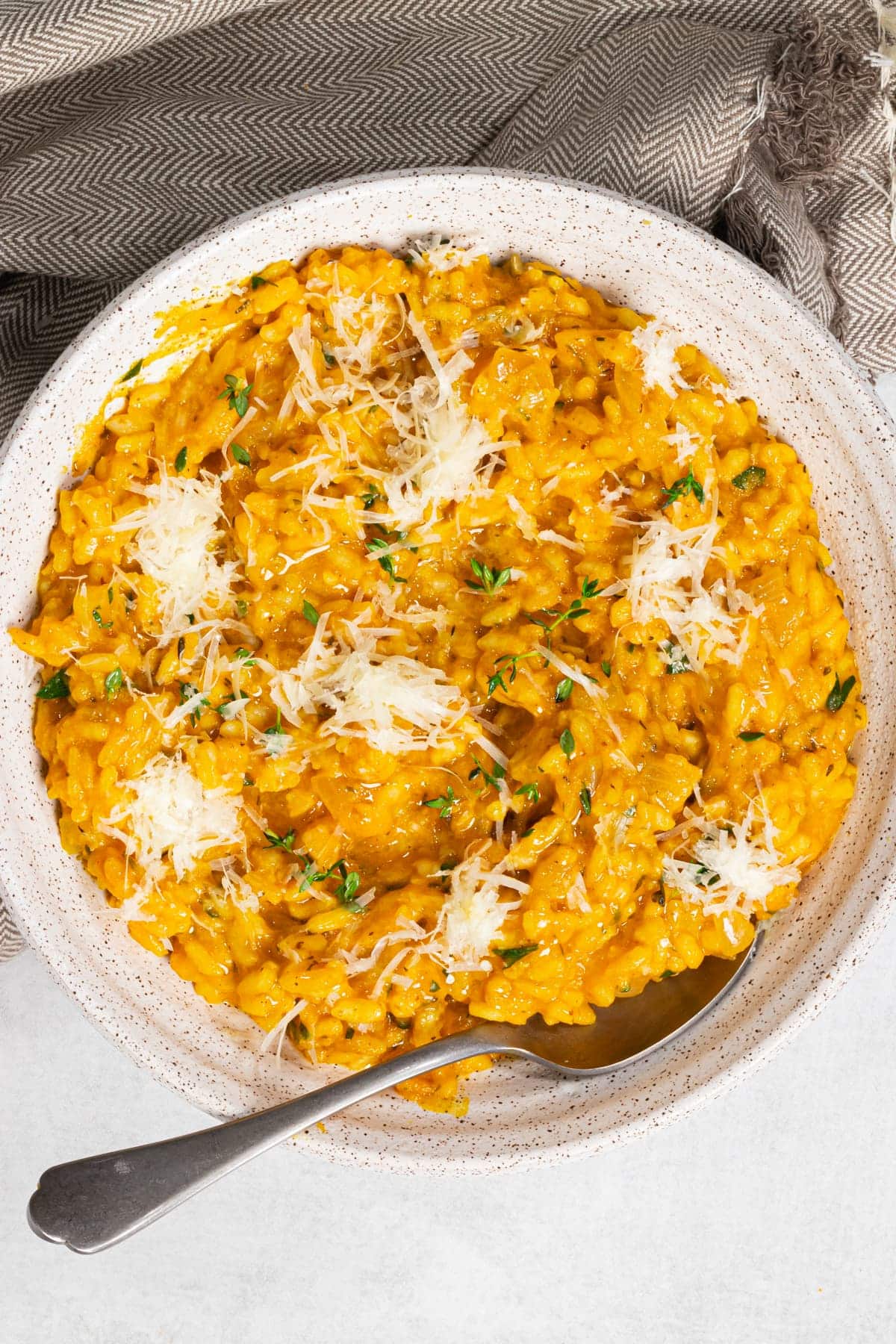 a white bowl full of vegan pumpkin risotto