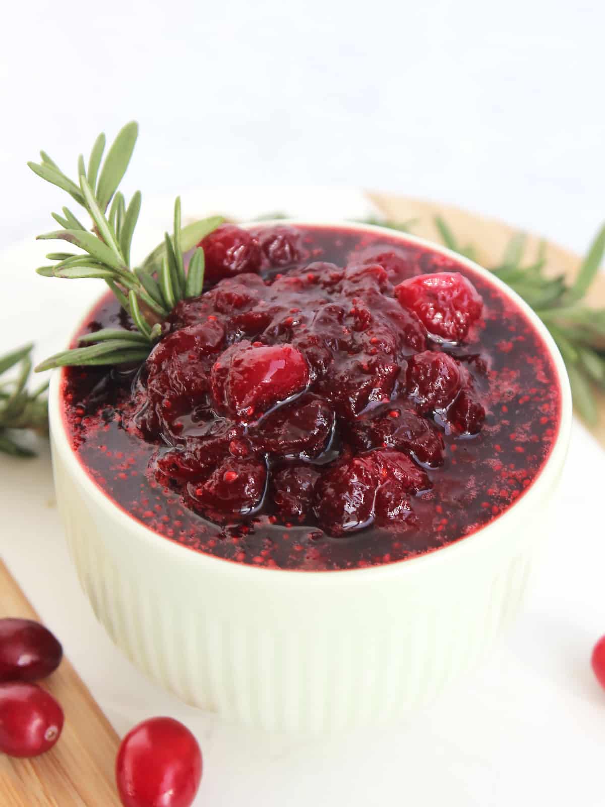 a white bowl full of cranberry sauce 