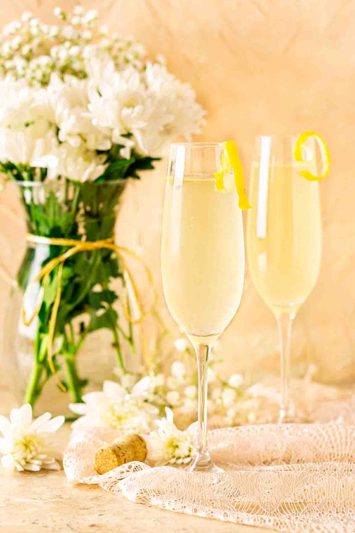 2 champagne cocktails on a beautiful table