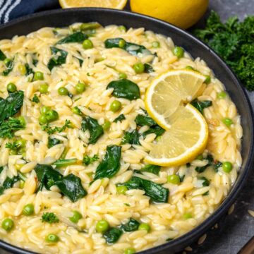 overhead view of lemon orzo in a black skillet