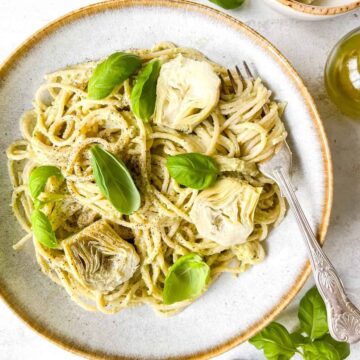 overhead view of artichoke pasta on a white plate