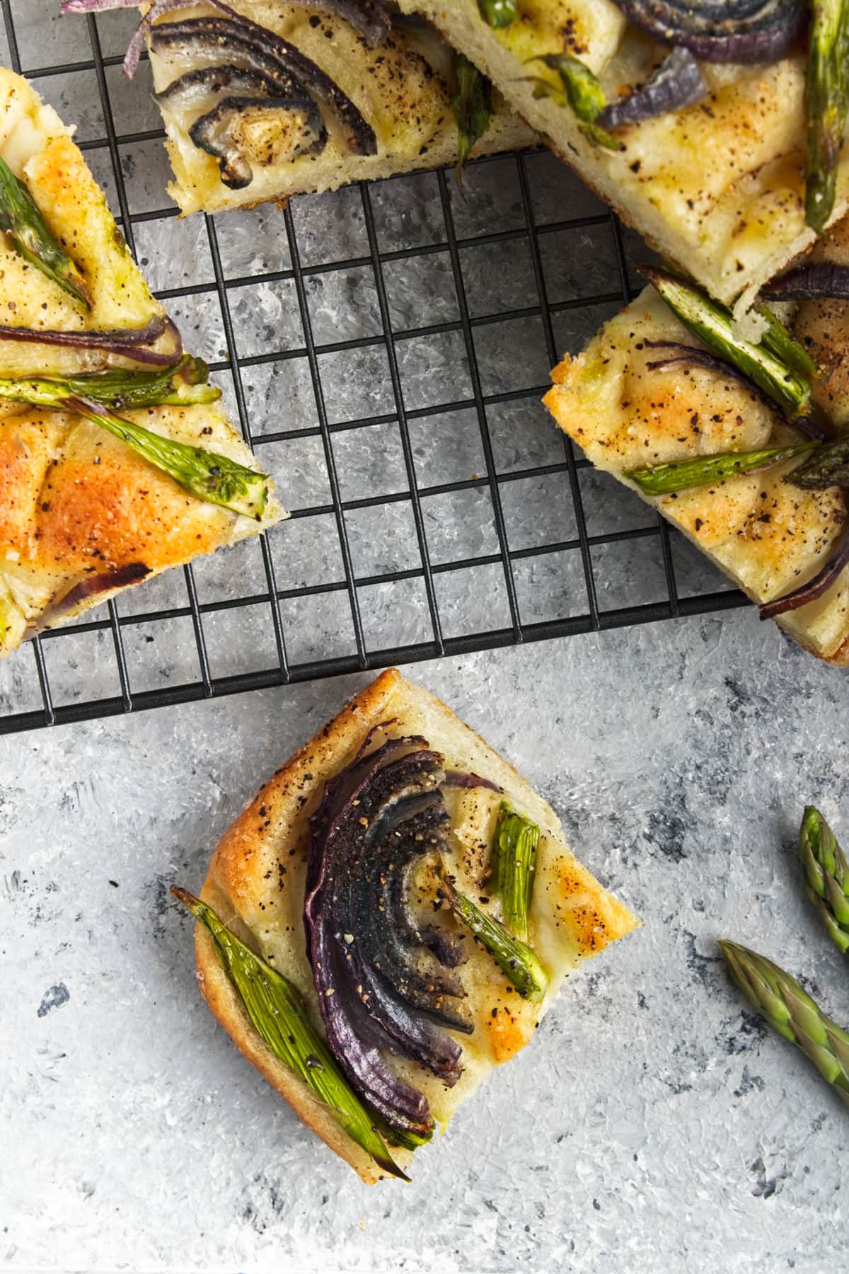 closeup overhead view of focaccia bread on a marble table