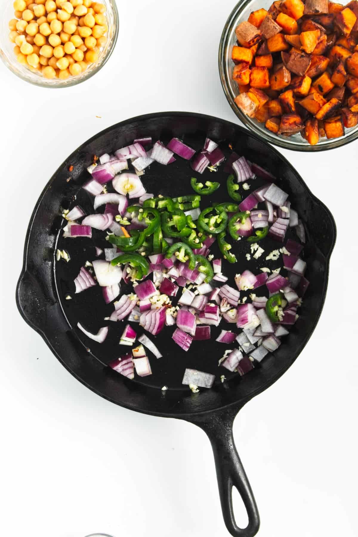 chopped vegetables in a black skillet