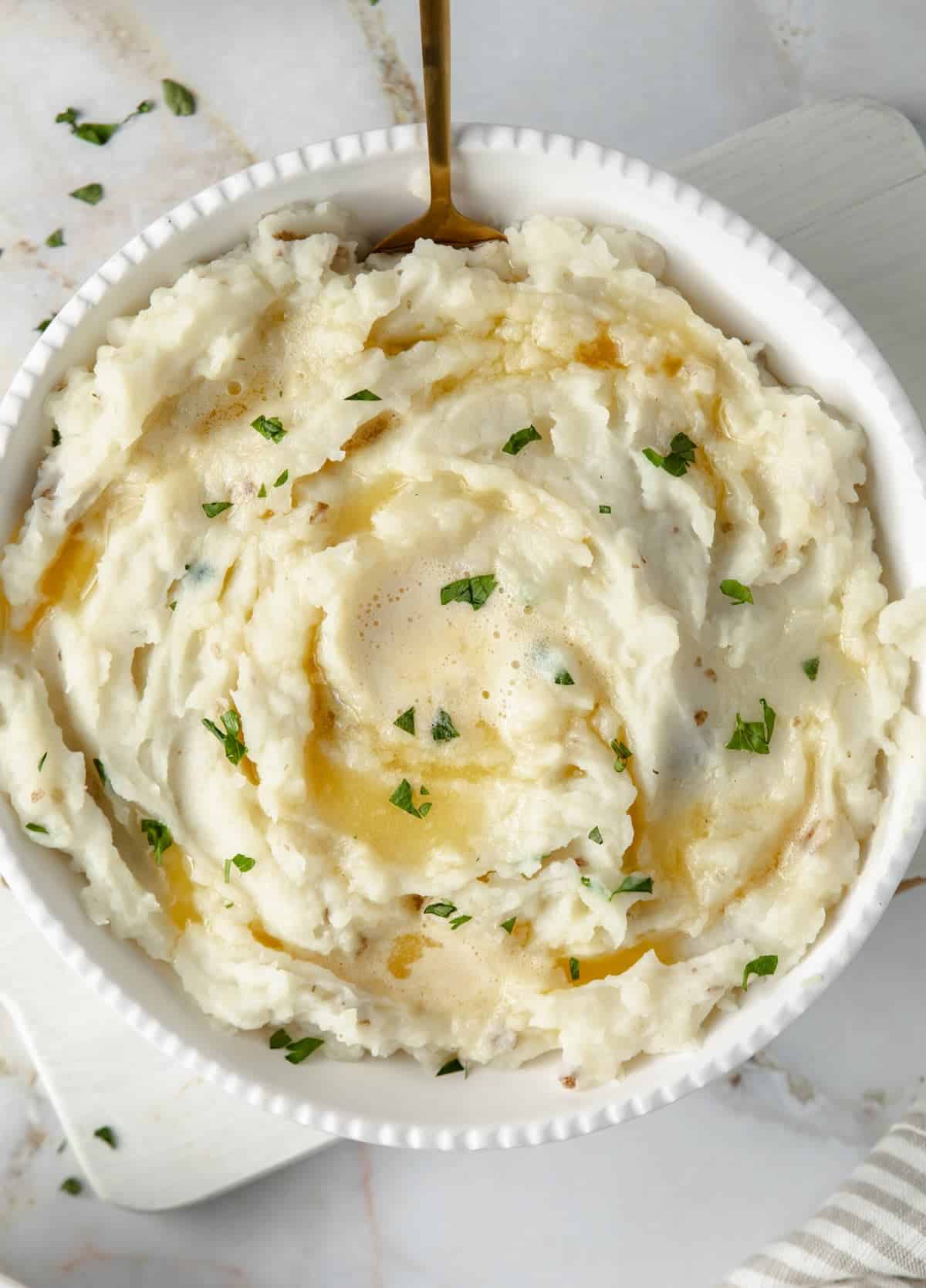 overhead view of dairy-free mashed potatoes on a marble table