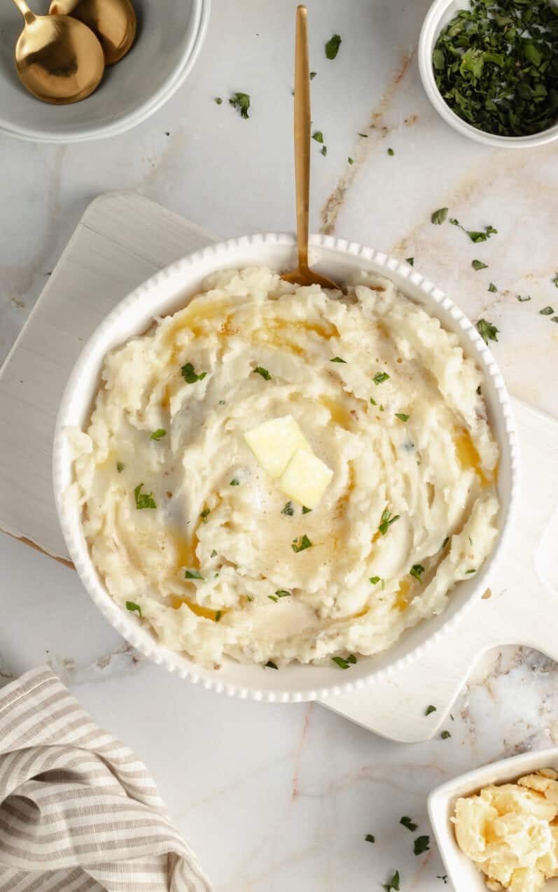 dairy-free-mashed-potatoes-with-butter on a marble table