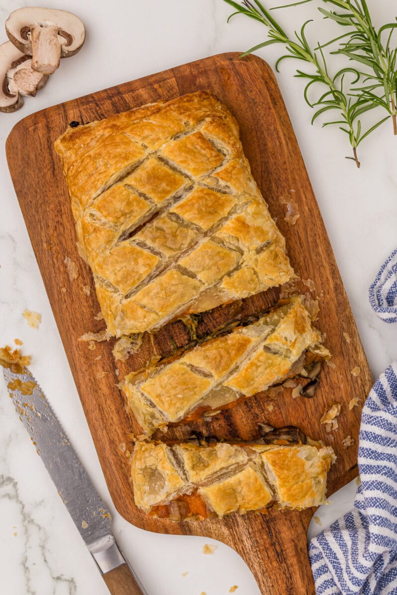 overhead view of vegan mushroom wellington on a cutting board