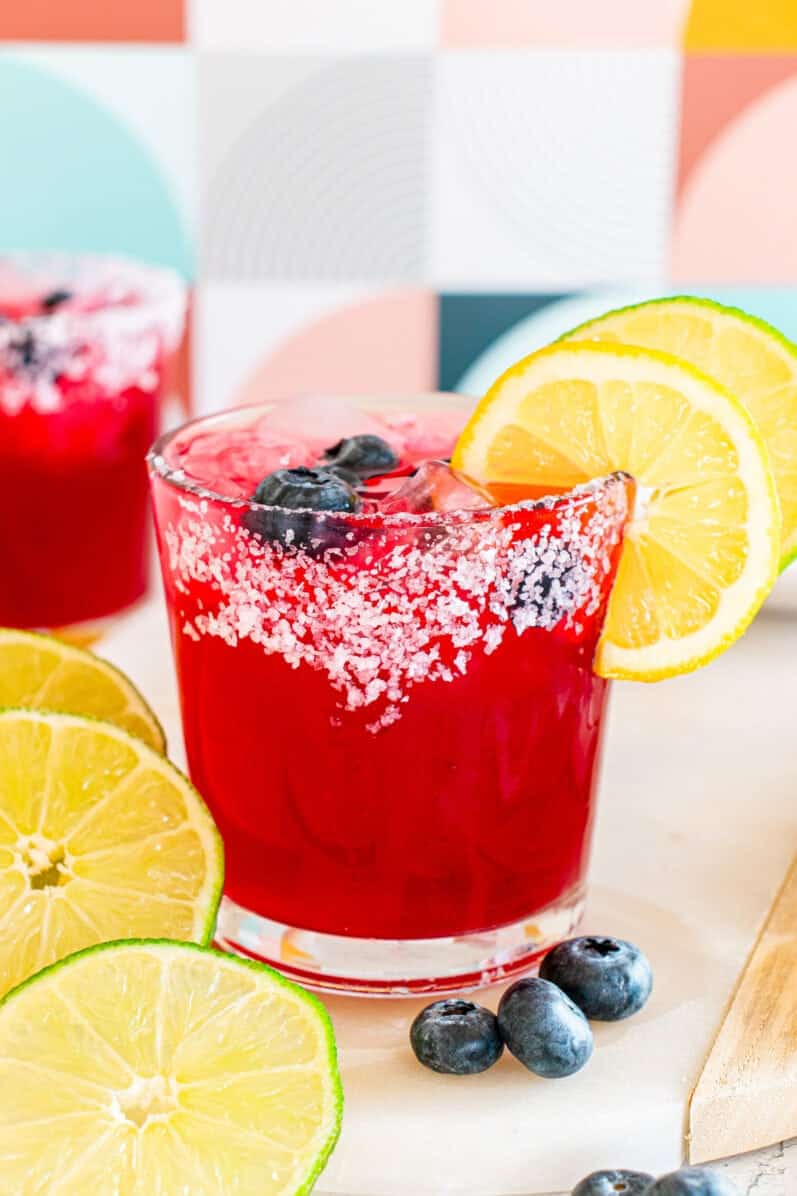 blueberry-lemonade-margarita with a pretty background