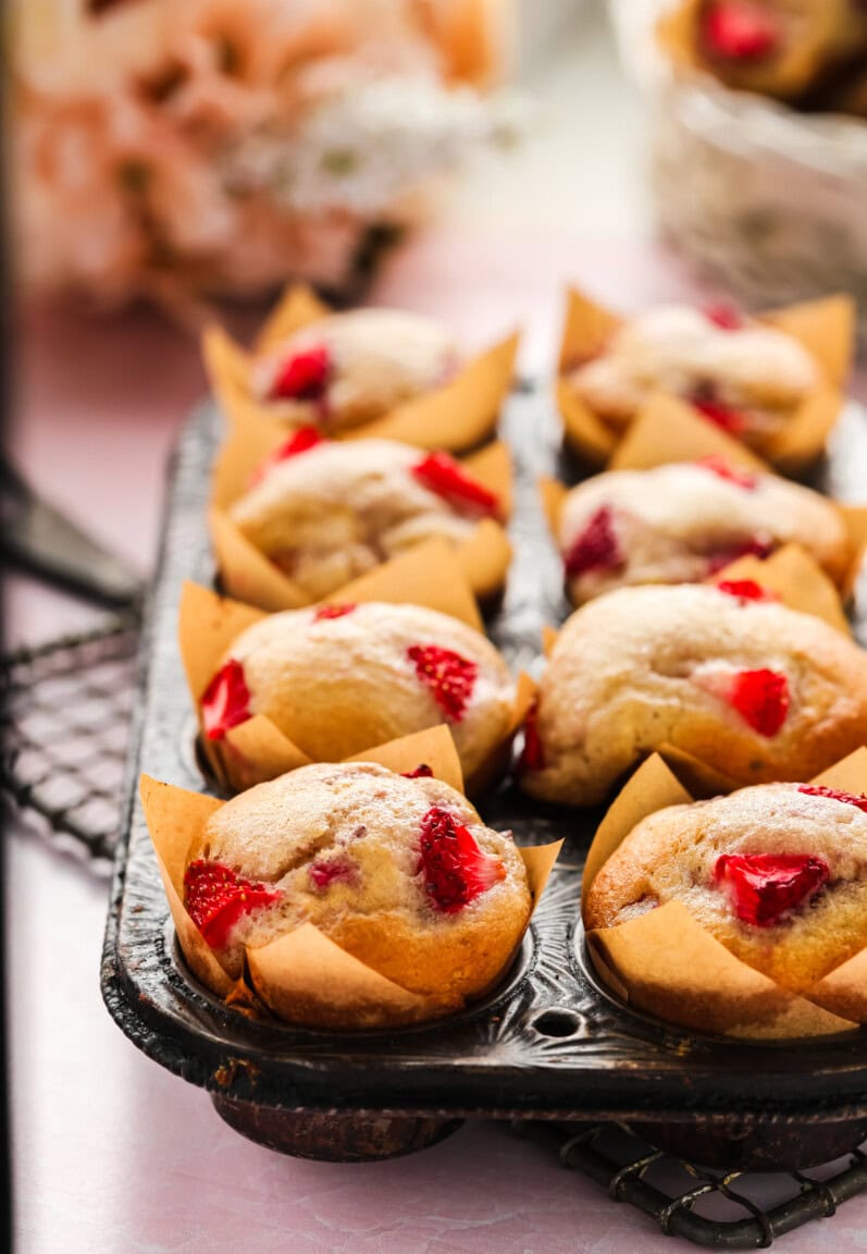 vegan strawberry muffins in a vintage muffin tin