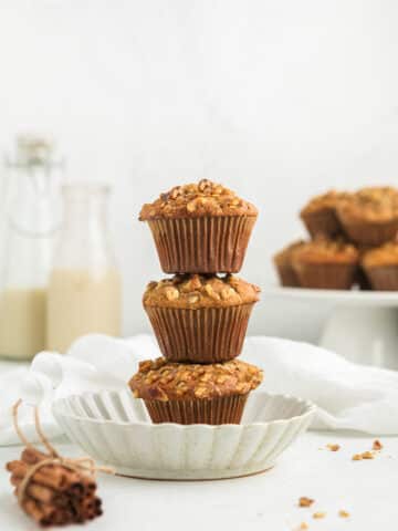 stack of vegan banana bread muffins on a white plate