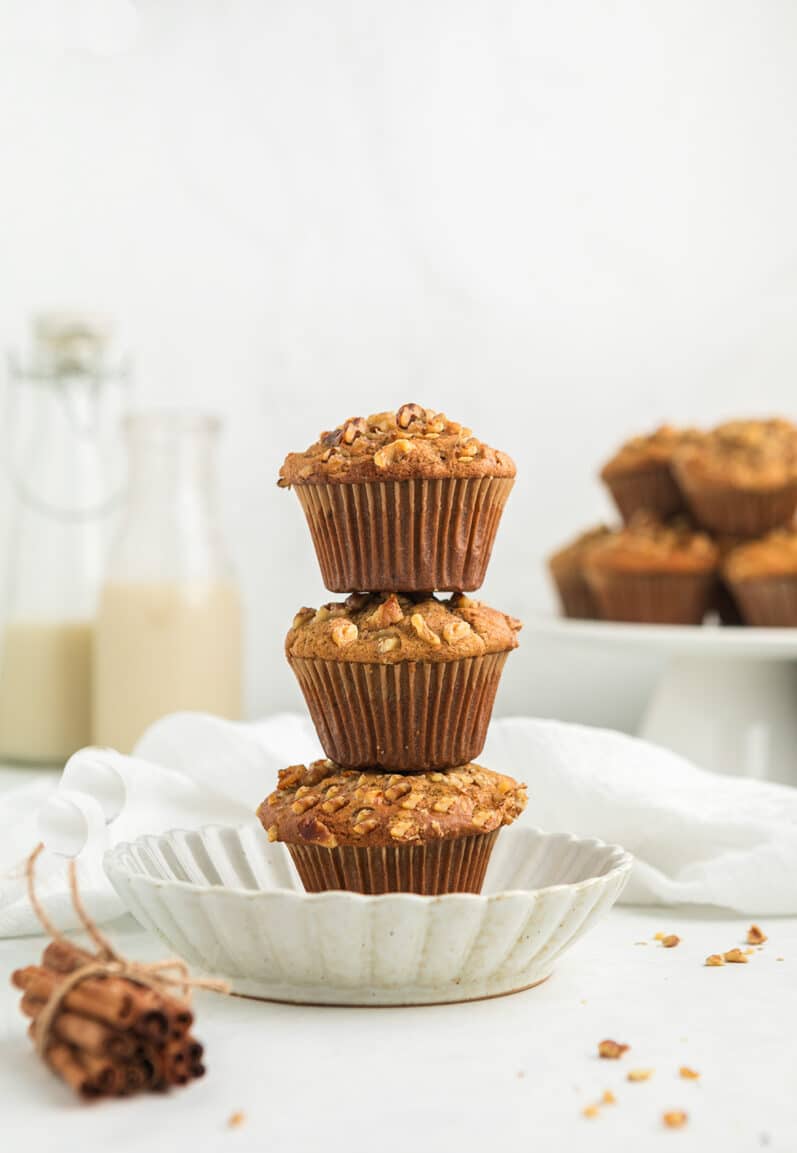 stack of vegan banana bread muffins on a white plate