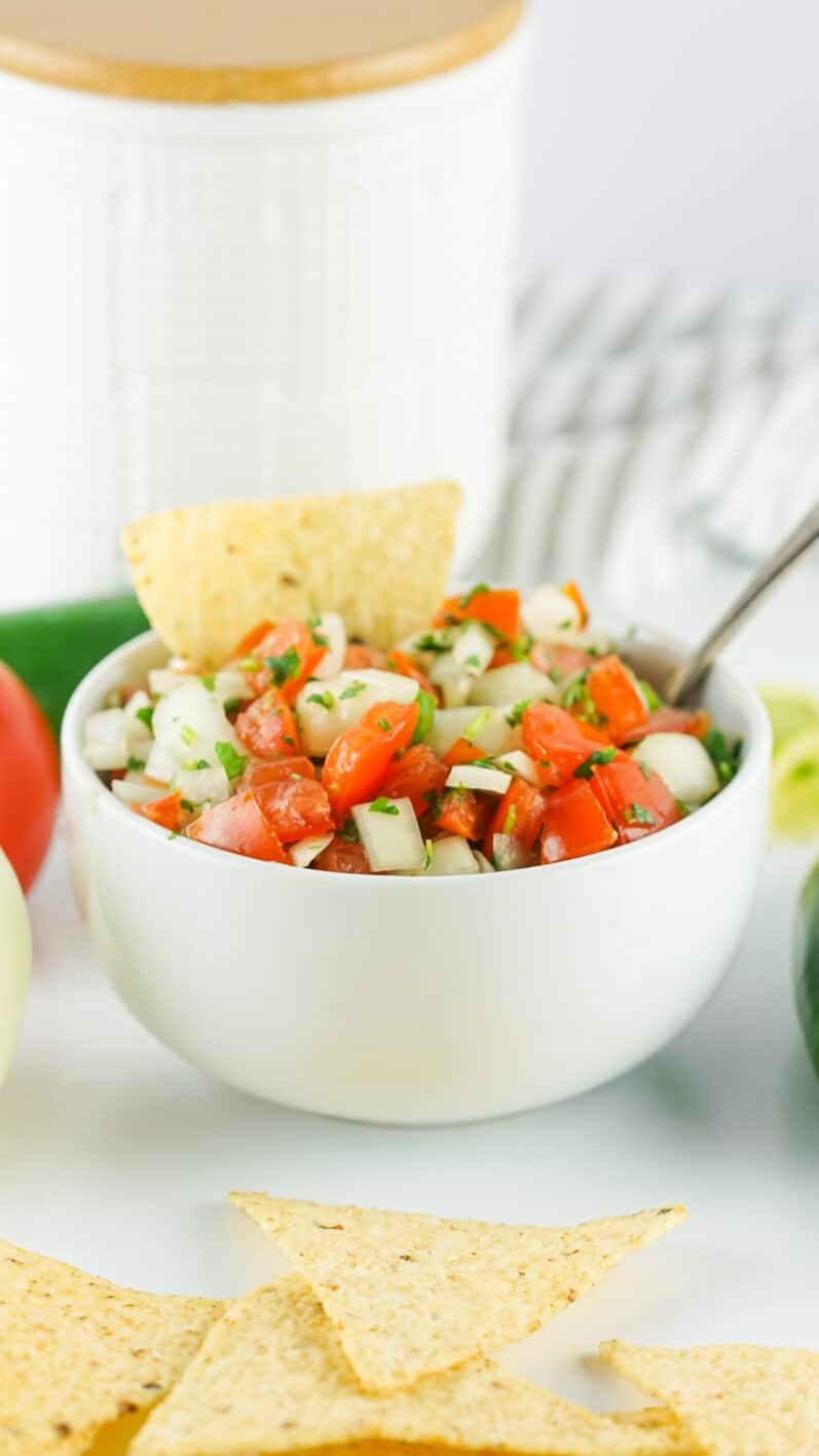 salsa fresca in a white bowl with chips