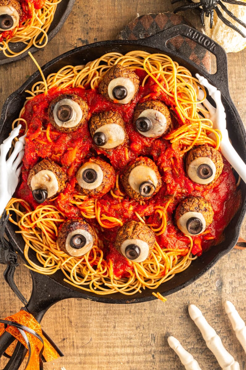 overhead view of halloween spaghetti and eyeballs in a cast iron skillet